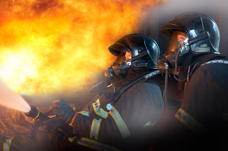 Firefighters with breathing apparatus connected with CEJN quick couplings and hose