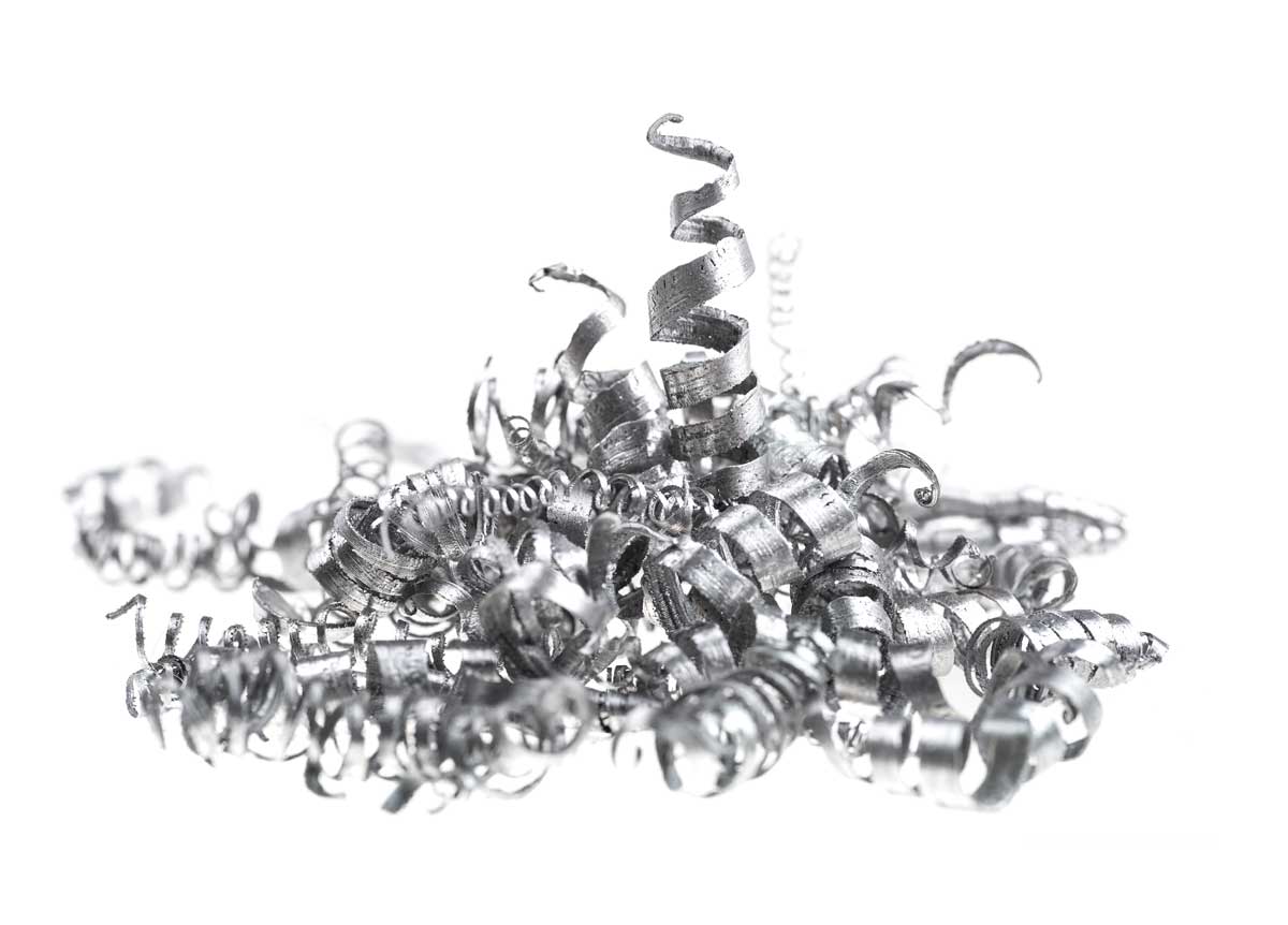 Metal chips and shavings on white background